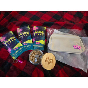 4 Primal Queen Supplements, container, keychain, and Beige crossbody Bag.